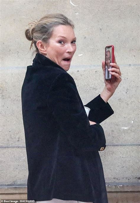 Kate Moss displays natural greys after walking the Fendi Paris show